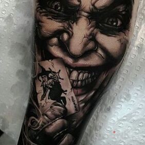 Tattoo Joker on the forearm motif: characters