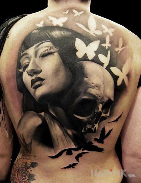 Tattoo Dziewczyna z czaszką in butterflies motif and realistic style on the back