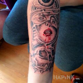 Tattoo Face of a woman , skull , eye of a wolf on the forearm motif: faces