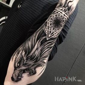 Tattoo Aggressive wolf on the forearm motif: animals