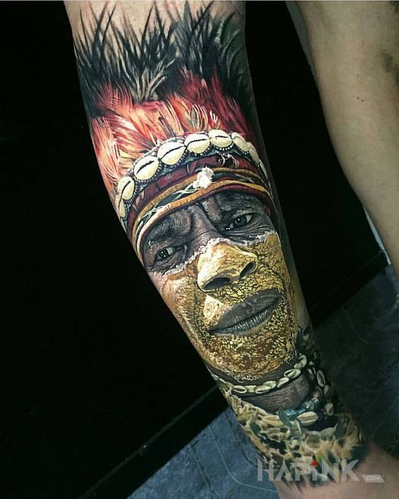 Tattoo Plemienna twarz in 3D motif and realistic style on the leg