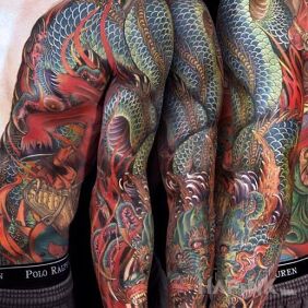 Tattoo Japanese dragon on the upper arm motif: sleeves style: japanese / irezumi