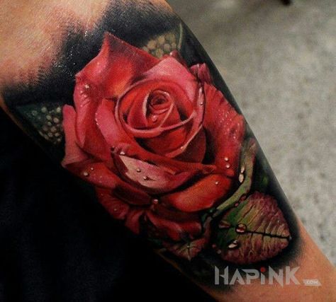 Tattoo Czerwona róża in flowers motif and realistic style on the forearm