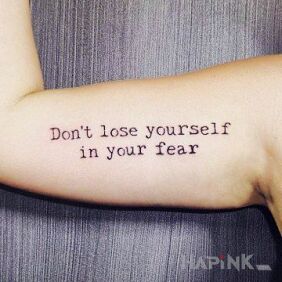 Tattoo You and your fear on the upper arm motif: lettering