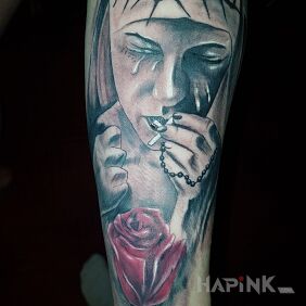 Tattoo Nun in tears on the forearm motif: faces