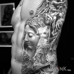 Tattoo Sculpture on the stomach motif: faces