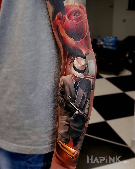 Tattoo Gangster in sleeves motif on the forearm