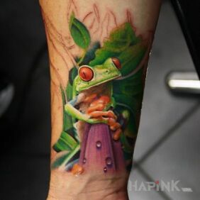 Tattoo Green toadstool on the forearm motif: animals style: realistic