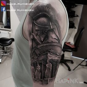 Tattoo Sparta on the upper arm motif: black and gray style: realistic
