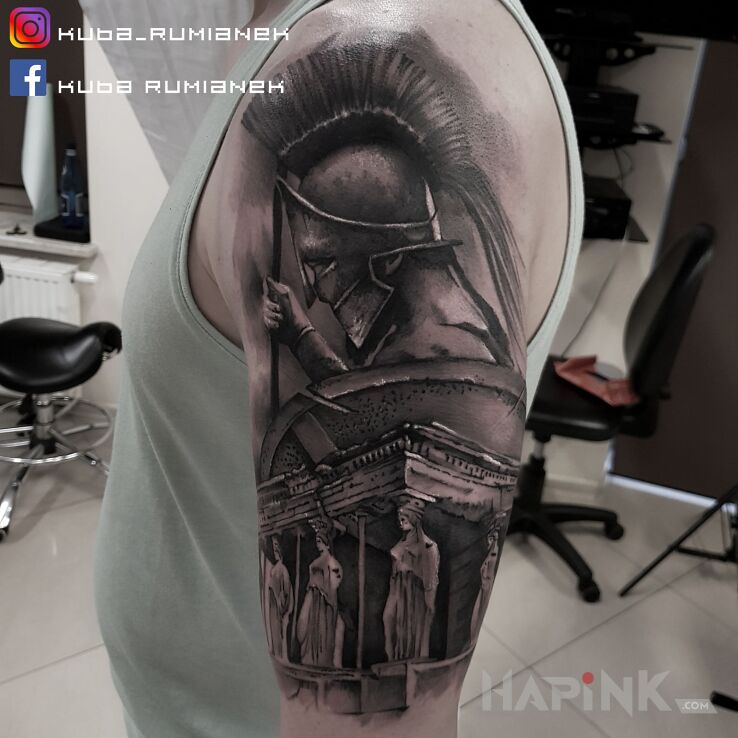 Tattoo Sparta in characters motif and realistic style on the upper arm