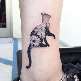Tattoo Cat in flowers on the leg motif: animals