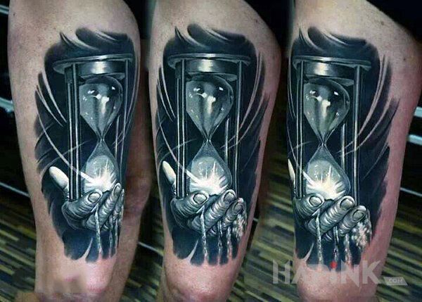 Tattoo Klepsydra in objects motif and realistic style on the leg
