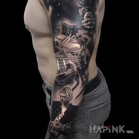 Tattoo Music on the upper arm motif: characters style: realistic