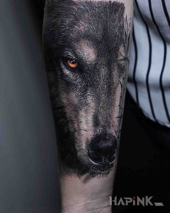 Tattoo Pysk wilka in animals motif and realistic style on the forearm