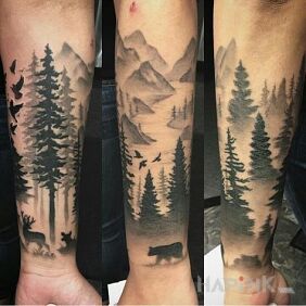 Tattoo Mountains and forest On the arm motif: animals style: graphic / illustrative