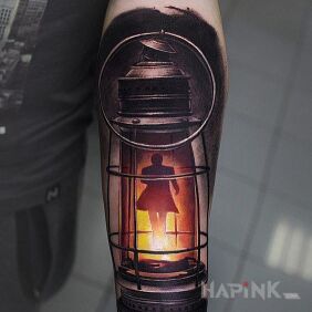 Tattoo Someone in a lamp on the forearm motif: colorful style: realistic