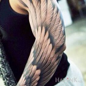 Tattoo A piece of wing on the forearm motif: angels style: realistic