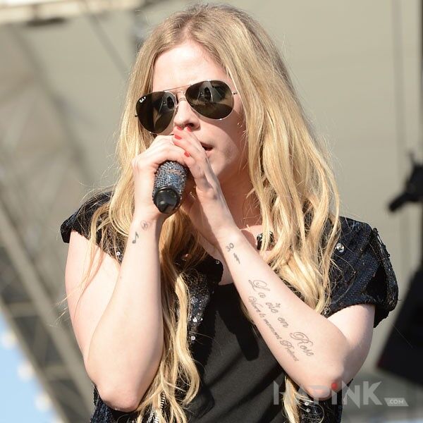 Tattoo Avril Lavigne - tatuaż napis in famous people motif on the forearm