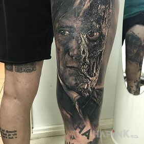 Tattoo Two faces on the leg motif: characters style: realistic