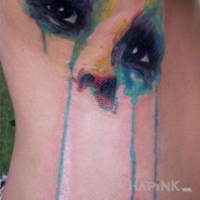 Tattoo Watercolor eyes on the ribs motif: colorful style: Watercolor