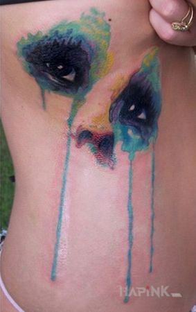 Tattoo Akwarelowe oczy in colorful motif and Watercolor style on the ribs