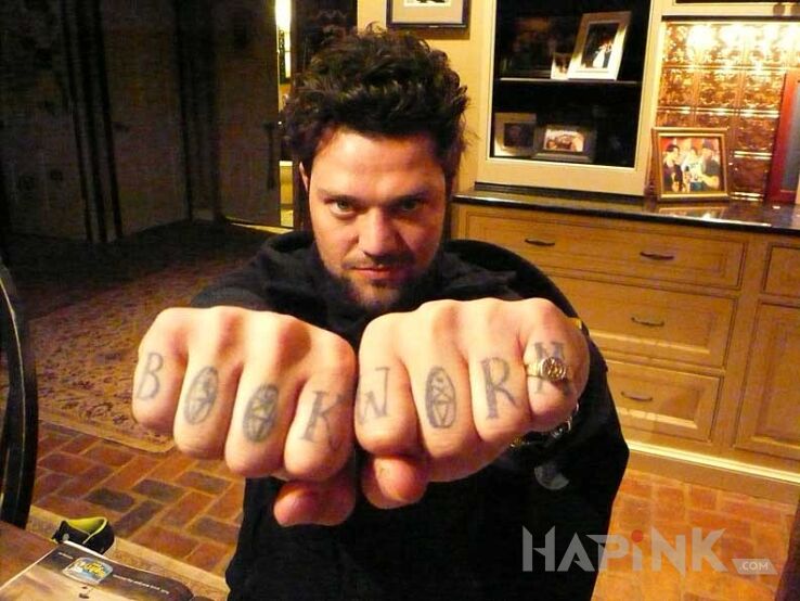 Tattoo Bam Margera in famous people motif on the hand