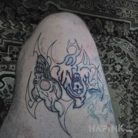 Tattoo Working on covering up an old tattoo on the leg motif: skulls