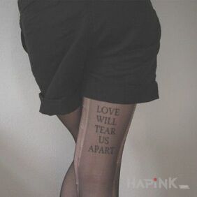 Tattoo Love on the leg motif: lettering