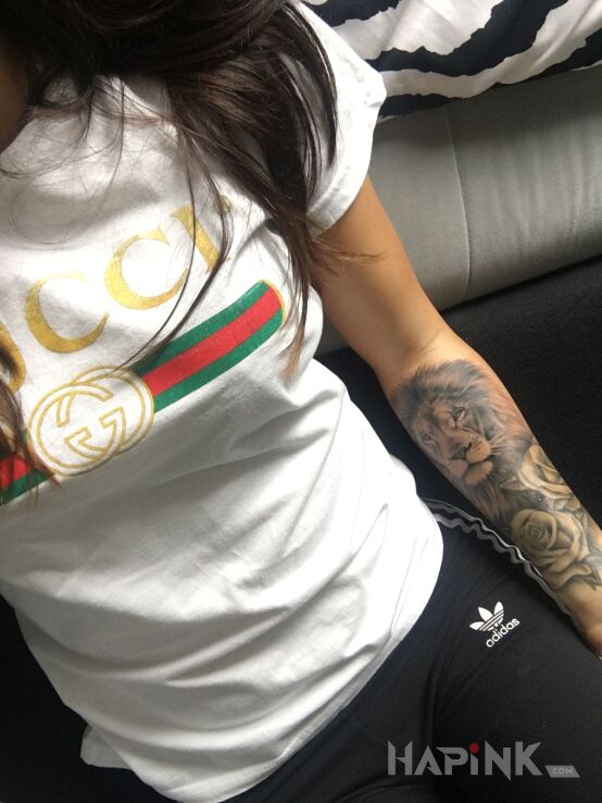Tattoo Lion in animals motif on the forearm