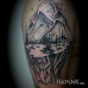 Tattoo Mountains on the upper arm motif: black and gray style: graphic / illustrative