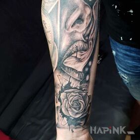 Tattoo Roza and Portrait of a Woman on the forearm motif: flowers