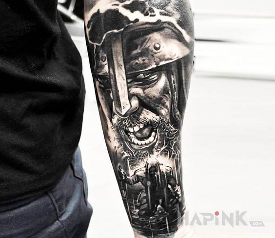 Tattoo Średniowiecze in faces motif and realistic style on the forearm