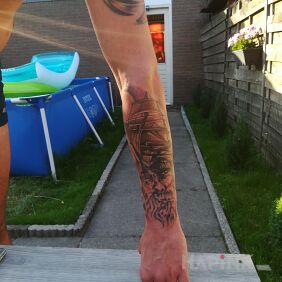 Tattoo Viking on the forearm motif: faces