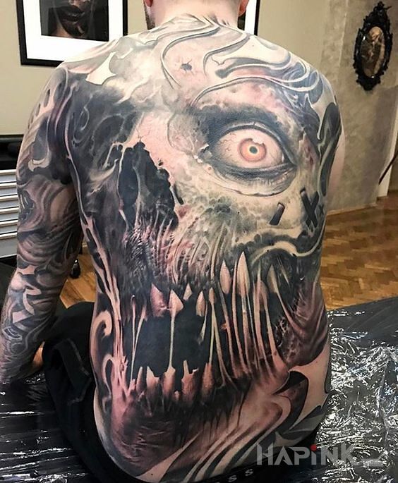Tattoo Przerażający tatuaż in demons motif on the back