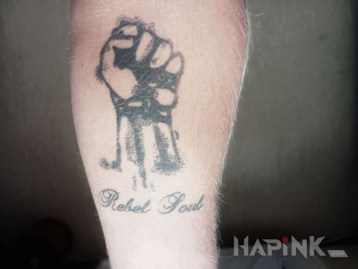 Tattoo Rebel Soul in other motif on the forearm