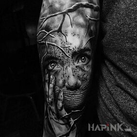 Tattoo Knebel on the forearm motif: faces style: realistic