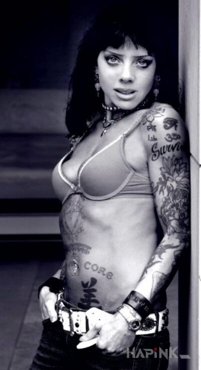 Tattoo Bif Naked - rękaw in famous people motif on the forearm