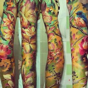 Tattoo Summer in full swing on the upper arm motif: colorful style: realistic