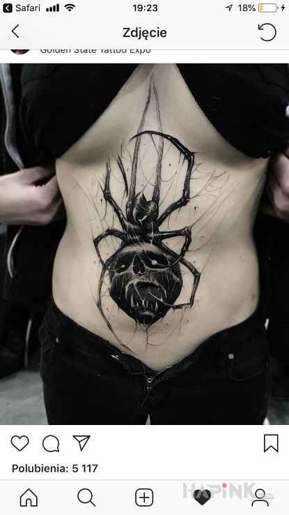 Tattoo Kolejna czacha in demons motif on the stomach