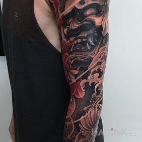 Tattoo Japanese lion on the upper arm motif: animals style: japanese / irezumi