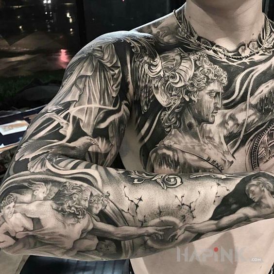 Tattoo Stworzenie adama in faces motif on the forearm