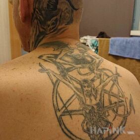 Tattoo Such as ?but they are mine and I like them ? on the back motif: black and gray style: graphic / illustrative
