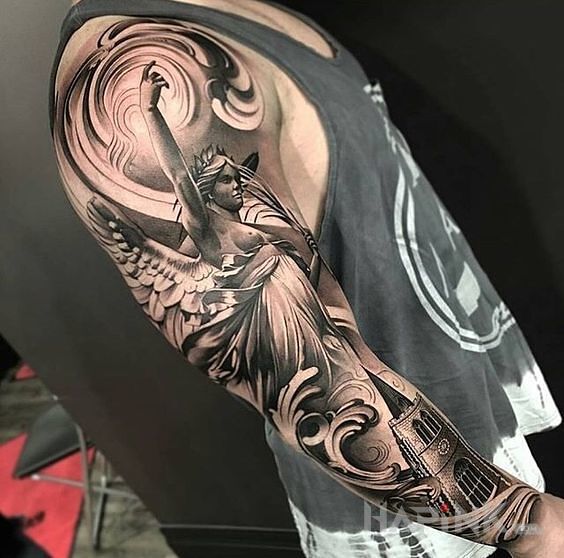 Tattoo Nike in characters motif on the upper arm