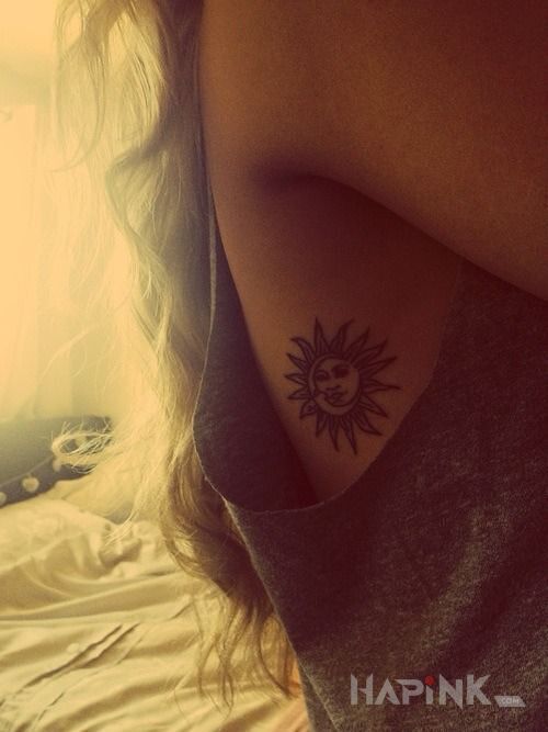 Tattoo Sloneczko in other motif on the ribs