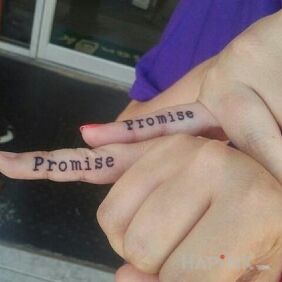 Tattoo Promise on the fingers motif: lettering