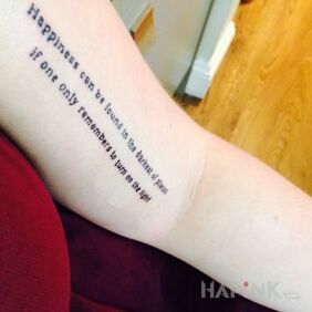 Tattoo Darkness on the forearm motif: lettering
