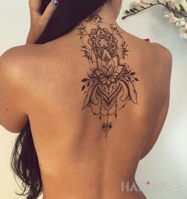Tattoo Lilia in flowers motif on the back