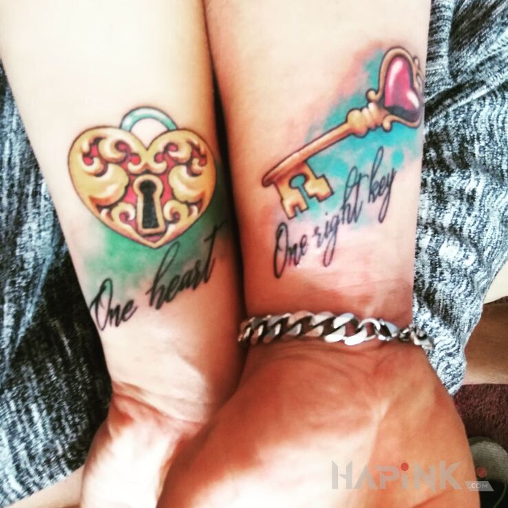 Tattoo One heart in colorful motif on the wrist