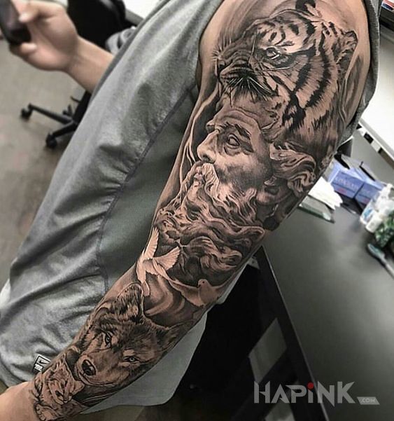 Tattoo Człowiek bliski naturze in faces motif and realistic style on the forearm