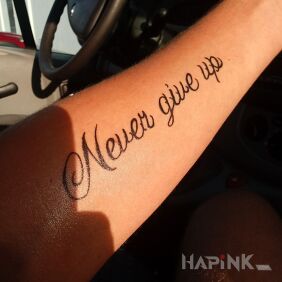 Tattoo Never give up on the forearm motif: lettering